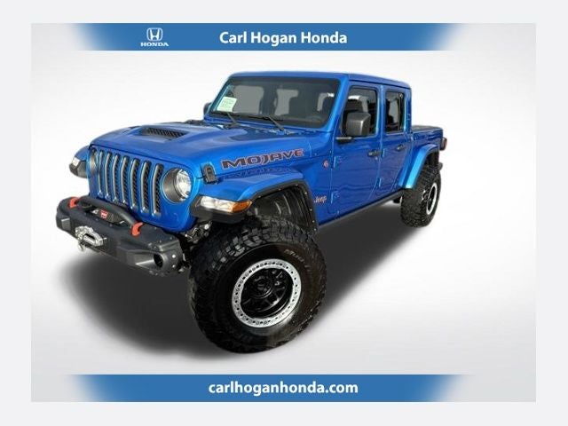 2022 Jeep Gladiator Mojave in Blue Pearl — front three-quarter view