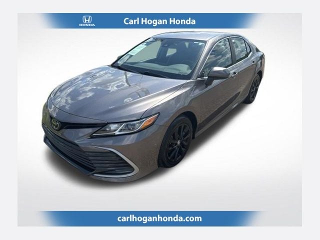 2024 Toyota Camry LE in Predawn Gray Mica — front three-quarter view